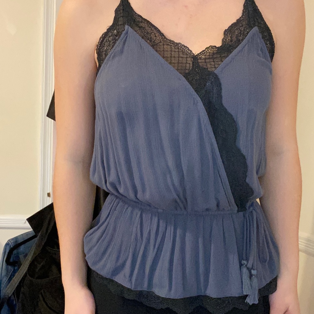 Sophisticated tank top with adjustable straps.